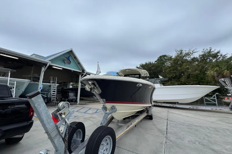  Yacht Photos Pics 2020 Chris-Craft Catalina 30 boat on trailer at marina, overcast sky.