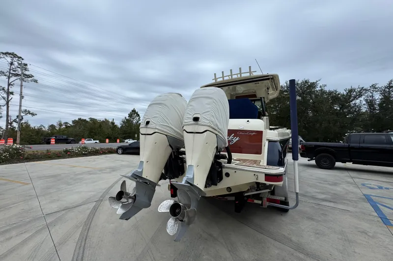  Yacht Photos Pics 2020 Chris-Craft Catalina 30 boat with covered outboard motors in a parking lot.