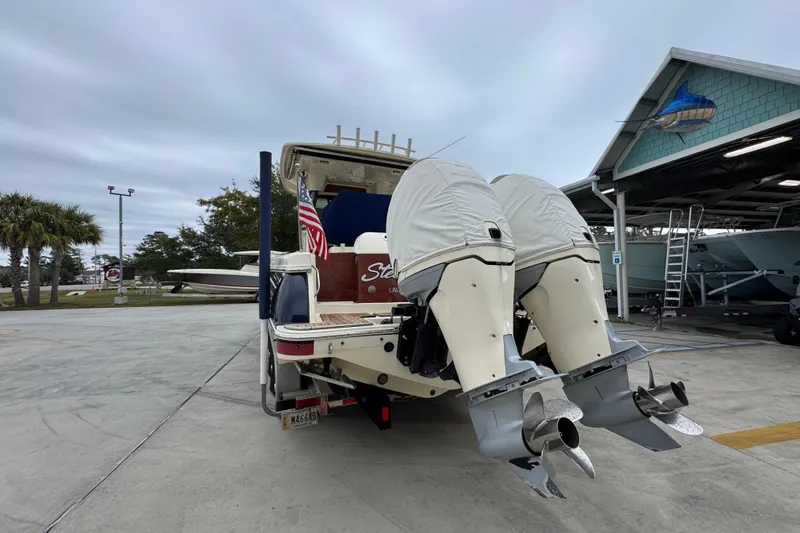  Yacht Photos Pics 2020 Chris-Craft Catalina 30 boat with dual outboard motors in a marina setting.