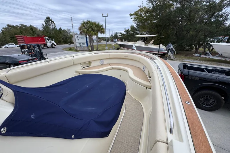  Yacht Photos Pics 2020 Chris-Craft Catalina 30 boat with covered seating area, parked outdoors.