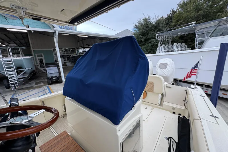  Yacht Photos Pics 2020 Chris-Craft Catalina 30 boat interior with covered console and American flag.