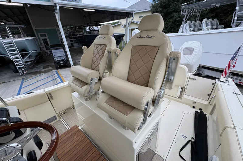  Yacht Photos Pics 2020 Chris-Craft Catalina 30 boat with luxurious beige seating and wooden accents.