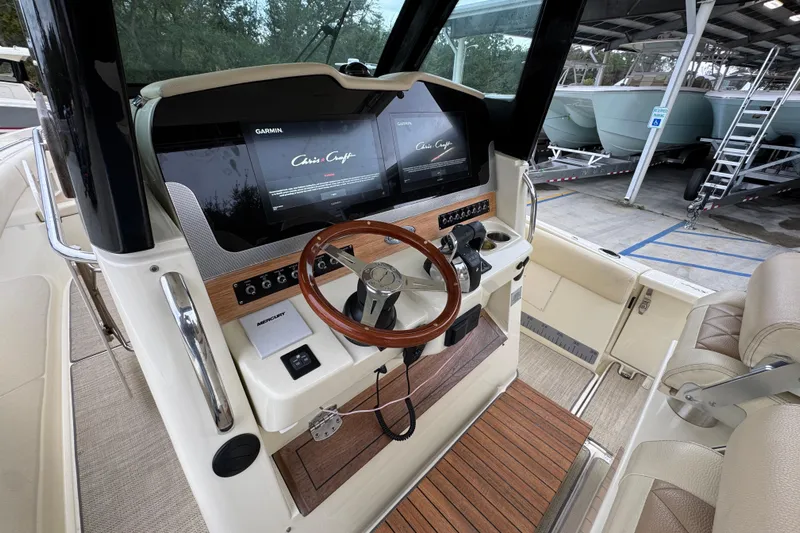  Yacht Photos Pics 2020 Chris-Craft Catalina 30 helm with Garmin displays and wooden steering wheel.
