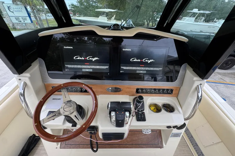  Yacht Photos Pics 2020 Chris-Craft Catalina 30 helm with Garmin displays and wooden steering wheel.