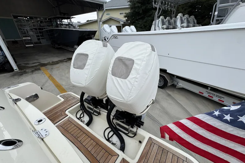  Yacht Photos Pics 2020 Chris-Craft Catalina 30 with covered outboard motors and American flag.