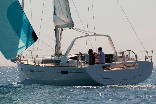 Secret Location Yacht Photos Pics 2014 Beneteau Oceanis 45 sailing on open water, featuring sleek design and spacious deck.