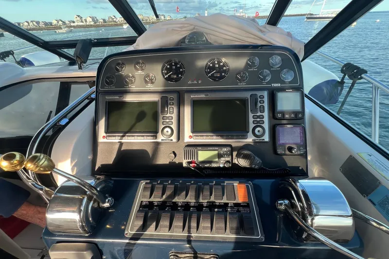 Yacht Photos Pics 2003 Tiara Yachts 3100 Open dashboard with navigation instruments and controls.