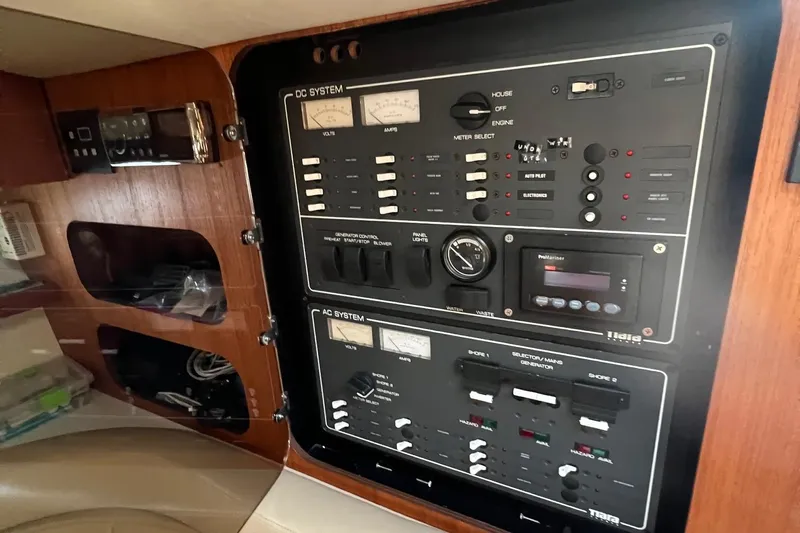  Yacht Photos Pics Control panel of a 2003 Tiara Yachts 3100 Open, featuring DC and AC systems.