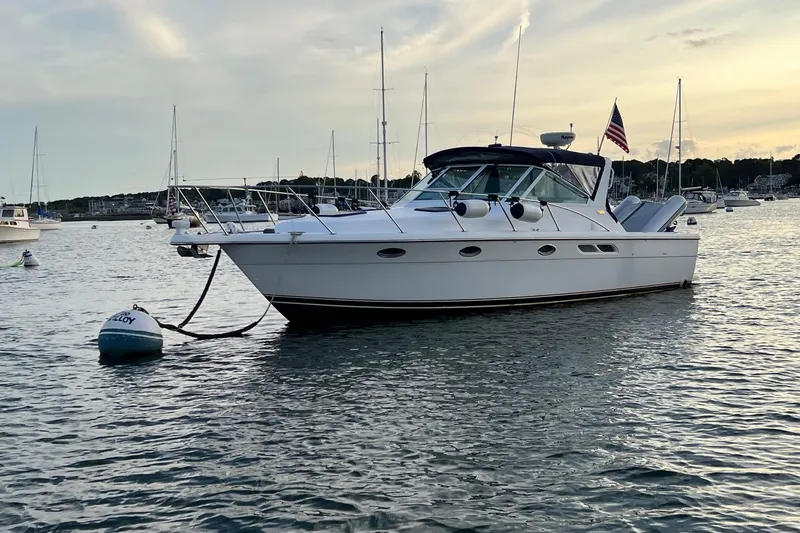  Yacht Photos Pics 2003 Tiara Yachts 3100 Open anchored in a serene harbor at sunset.