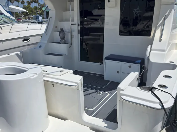 Sanctuary Yacht Photos Pics 2006 Silverton 36 Convertible yacht interior with seating and storage, docked at marina.