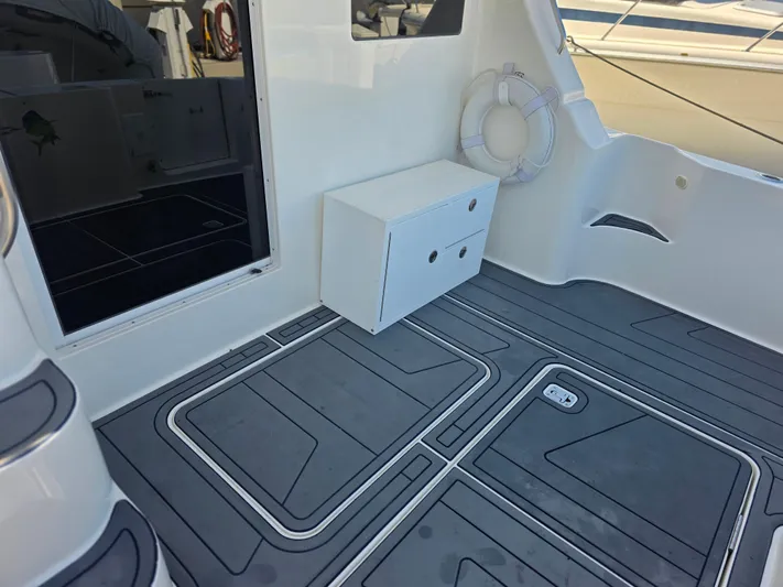 Sanctuary Yacht Photos Pics 2006 Silverton 36 Convertible boat deck with storage and life preserver.