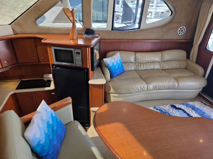 Sanctuary Yacht Photos Pics Interior of 2006 Silverton 36 Convertible yacht with leather seating and modern amenities.