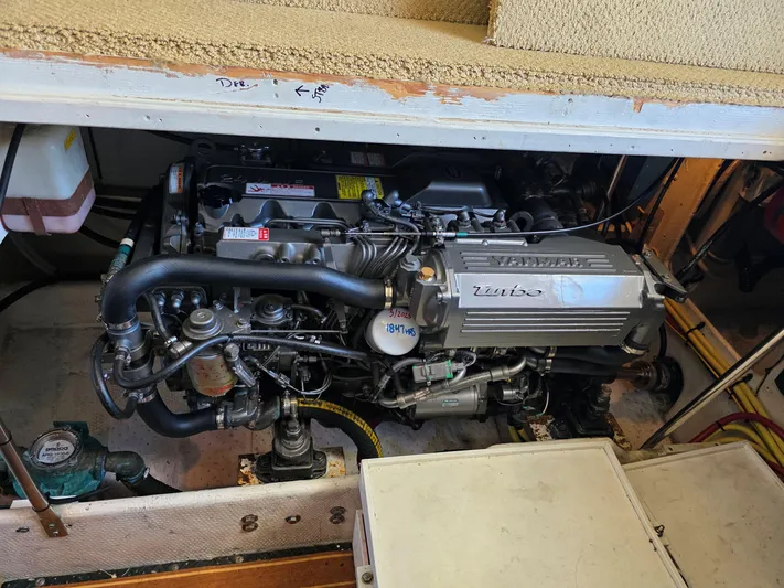 Sanctuary Yacht Photos Pics Engine compartment of a 2006 Silverton 36 Convertible boat, showcasing a turbo engine.