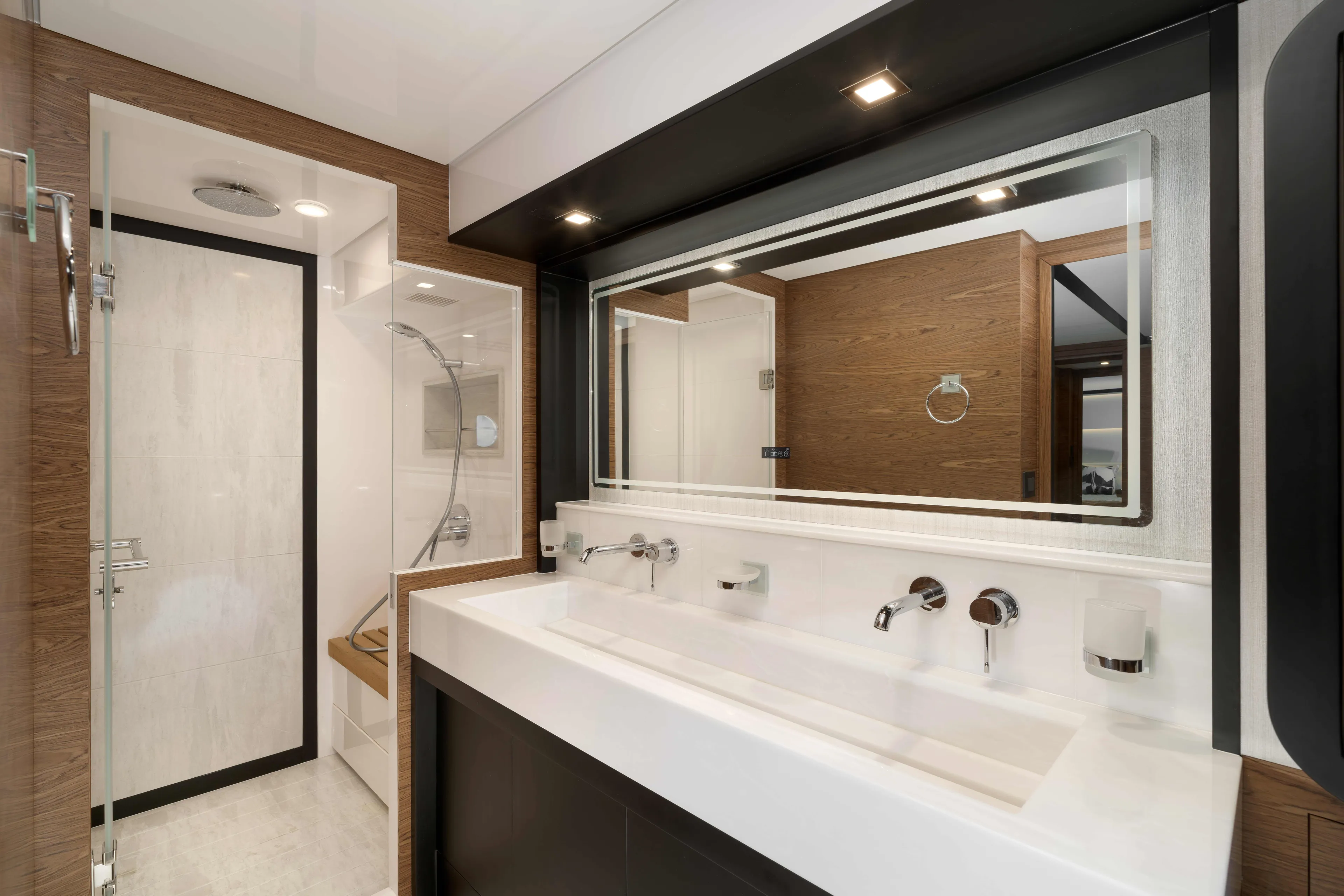 V77s-613 / Available Spring 2026 Yacht Photos Pics Modern bathroom interior in Horizon V77S yacht, 2026 model, featuring sleek design and luxury fixtures.