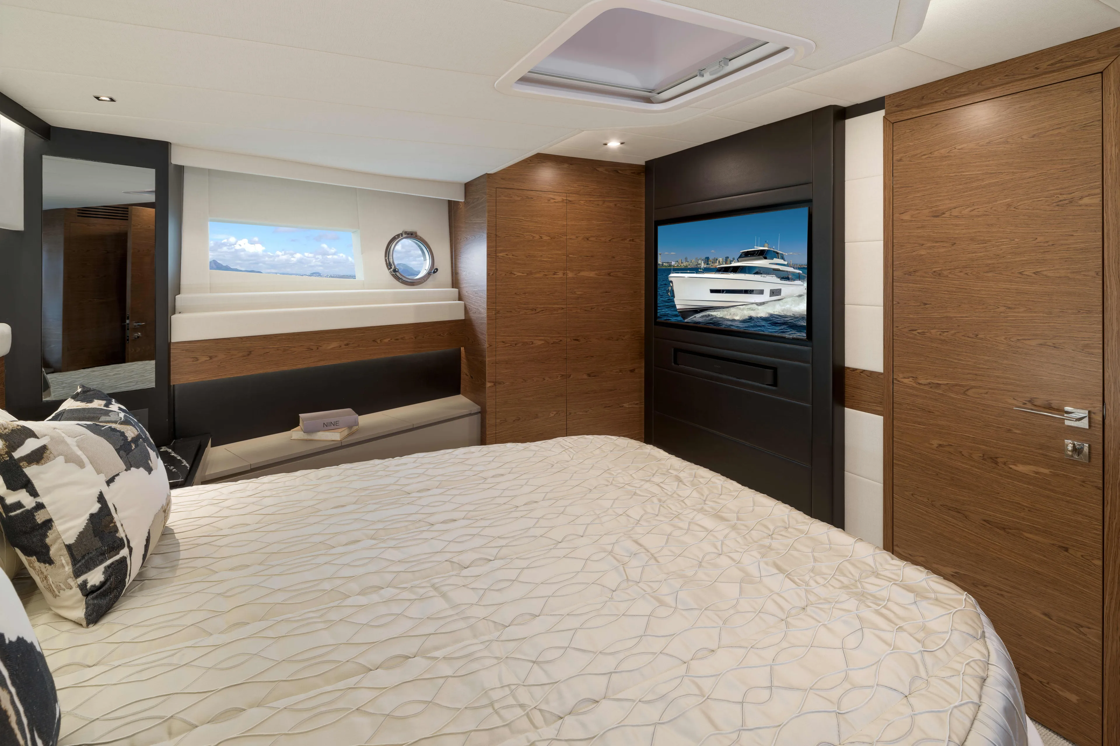 V77s-613 / Available Spring 2026 Yacht Photos Pics Luxurious bedroom interior of 2026 Horizon V77S yacht with modern design elements.