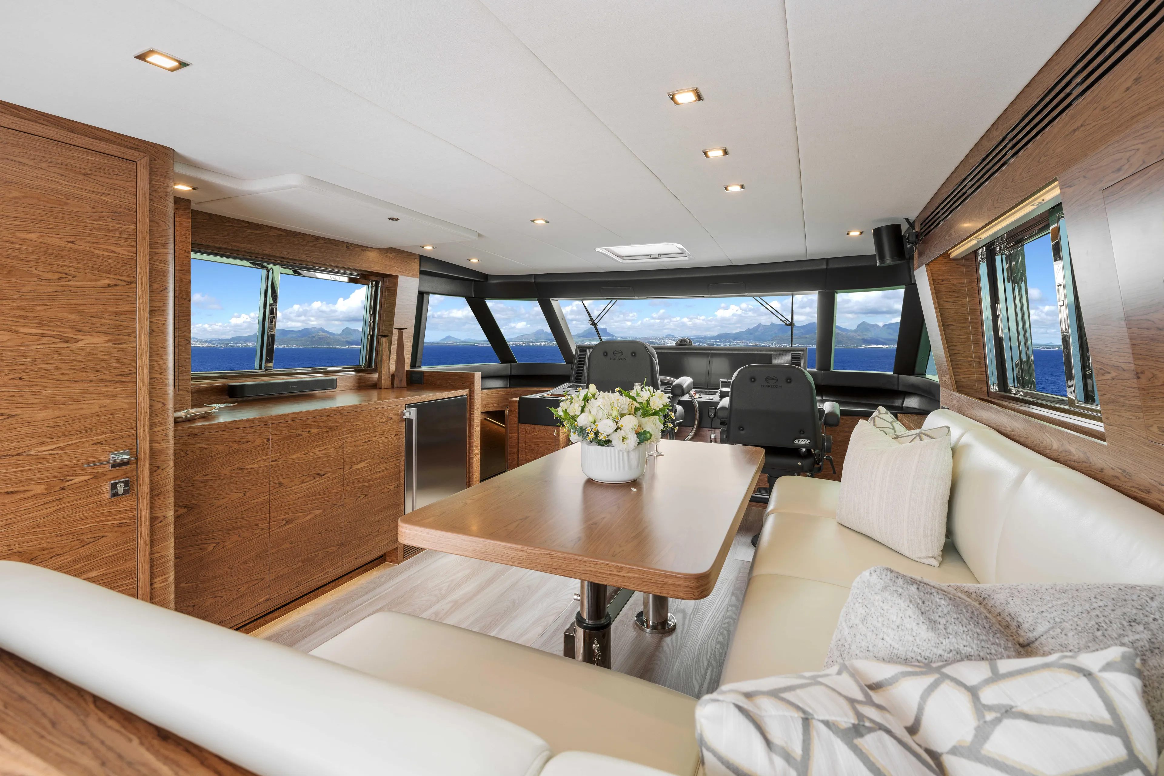 V77s-613 / Available Spring 2026 Yacht Photos Pics Luxurious Horizon V77S yacht interior, featuring elegant wood finishes and ocean views, 2026 model.