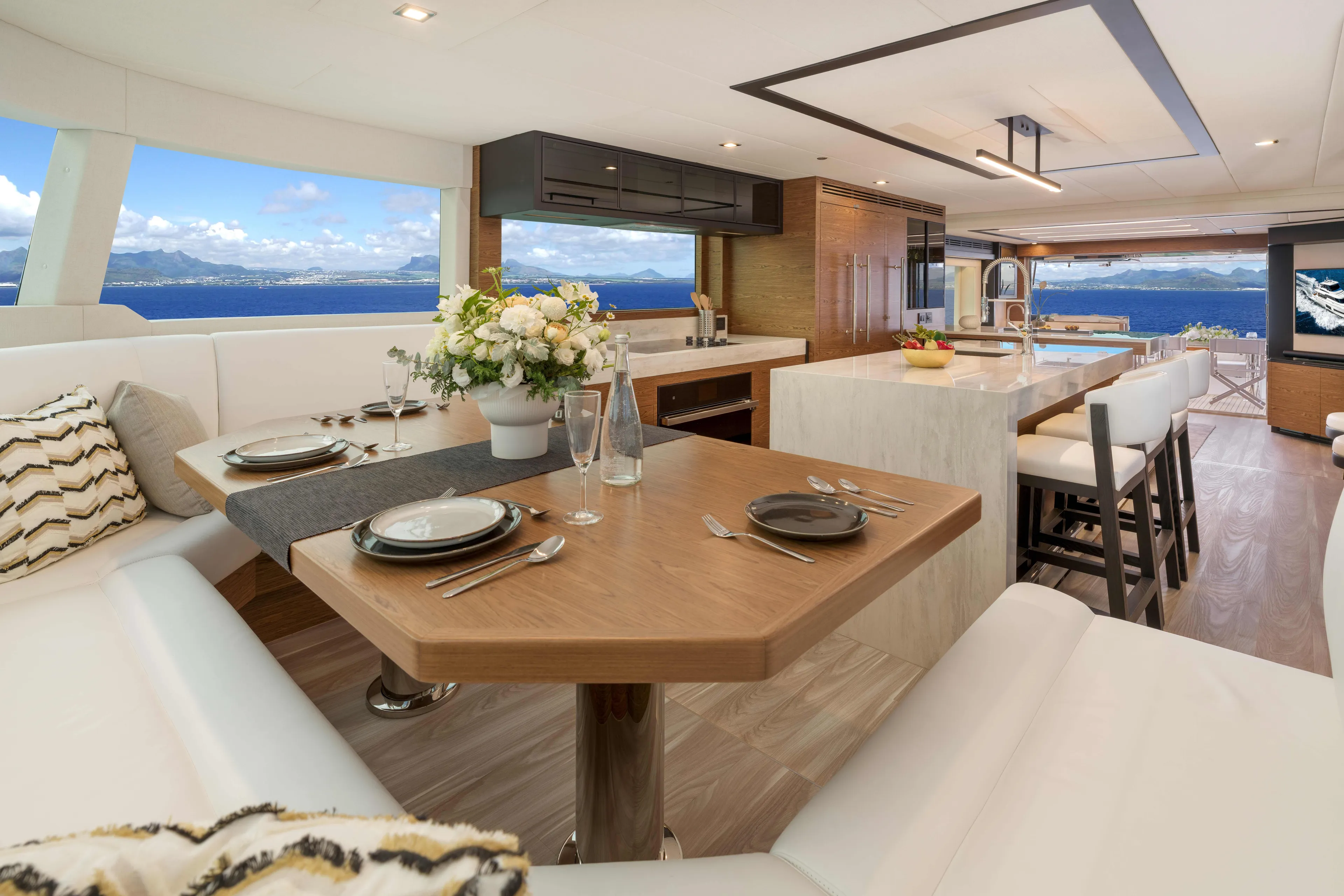 V77s-613 / Available Spring 2026 Yacht Photos Pics Luxurious Horizon V77S yacht interior with elegant dining area and ocean view, 2026 model.