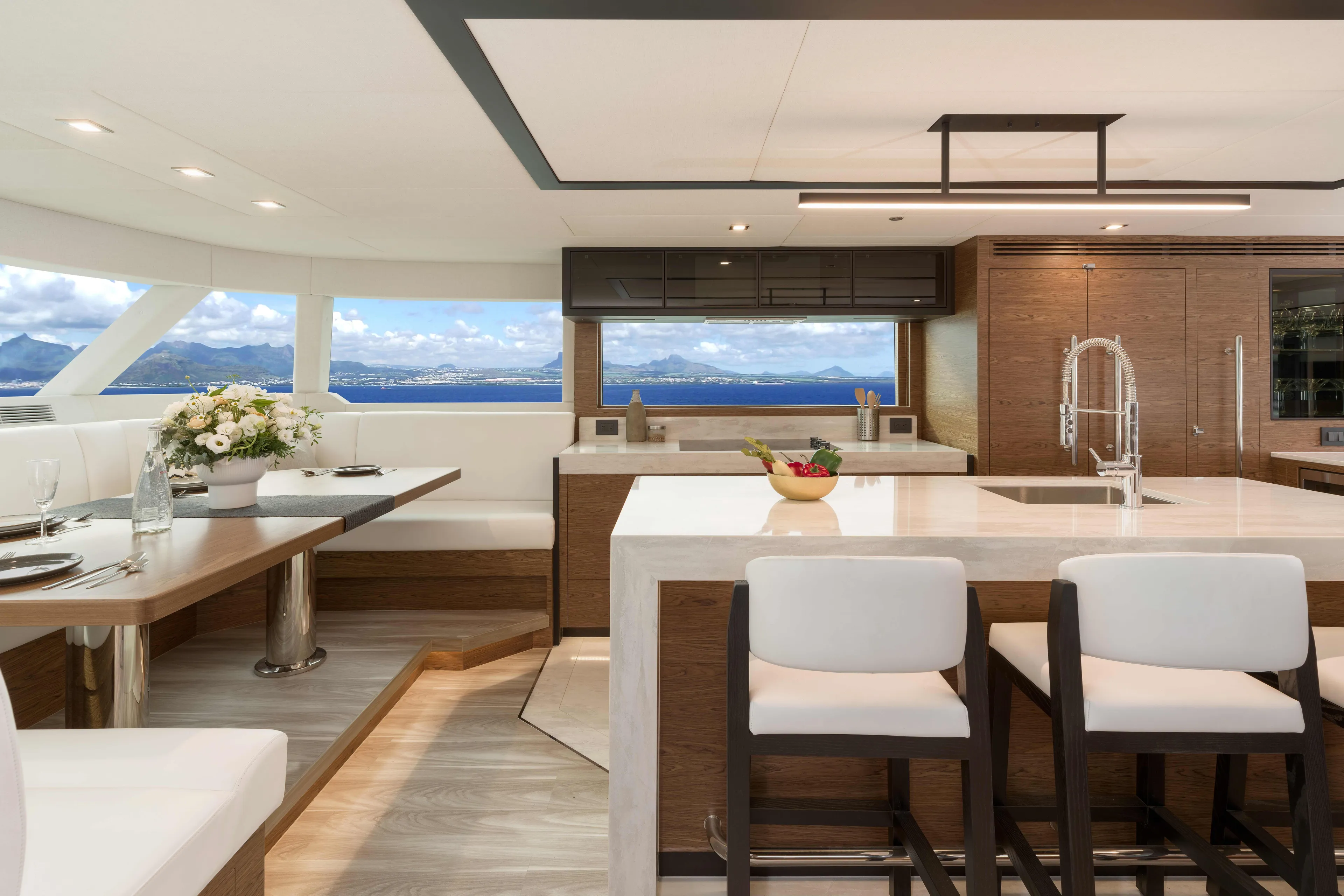 V77s-613 / Available Spring 2026 Yacht Photos Pics Luxurious Horizon V77S yacht interior with modern kitchen and dining area, ocean view, 2026 model.
