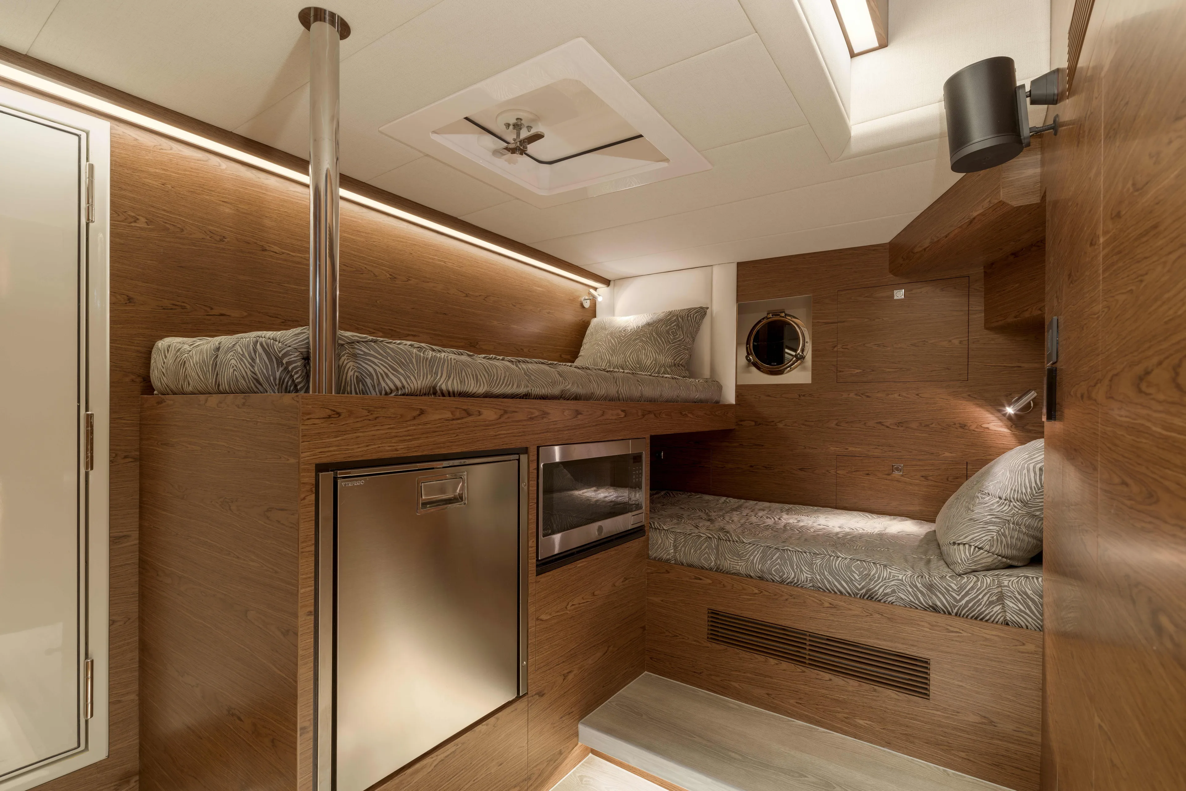 V77s-613 / Available Spring 2026 Yacht Photos Pics Luxurious 2026 Horizon V77S yacht cabin with wood paneling and modern amenities.