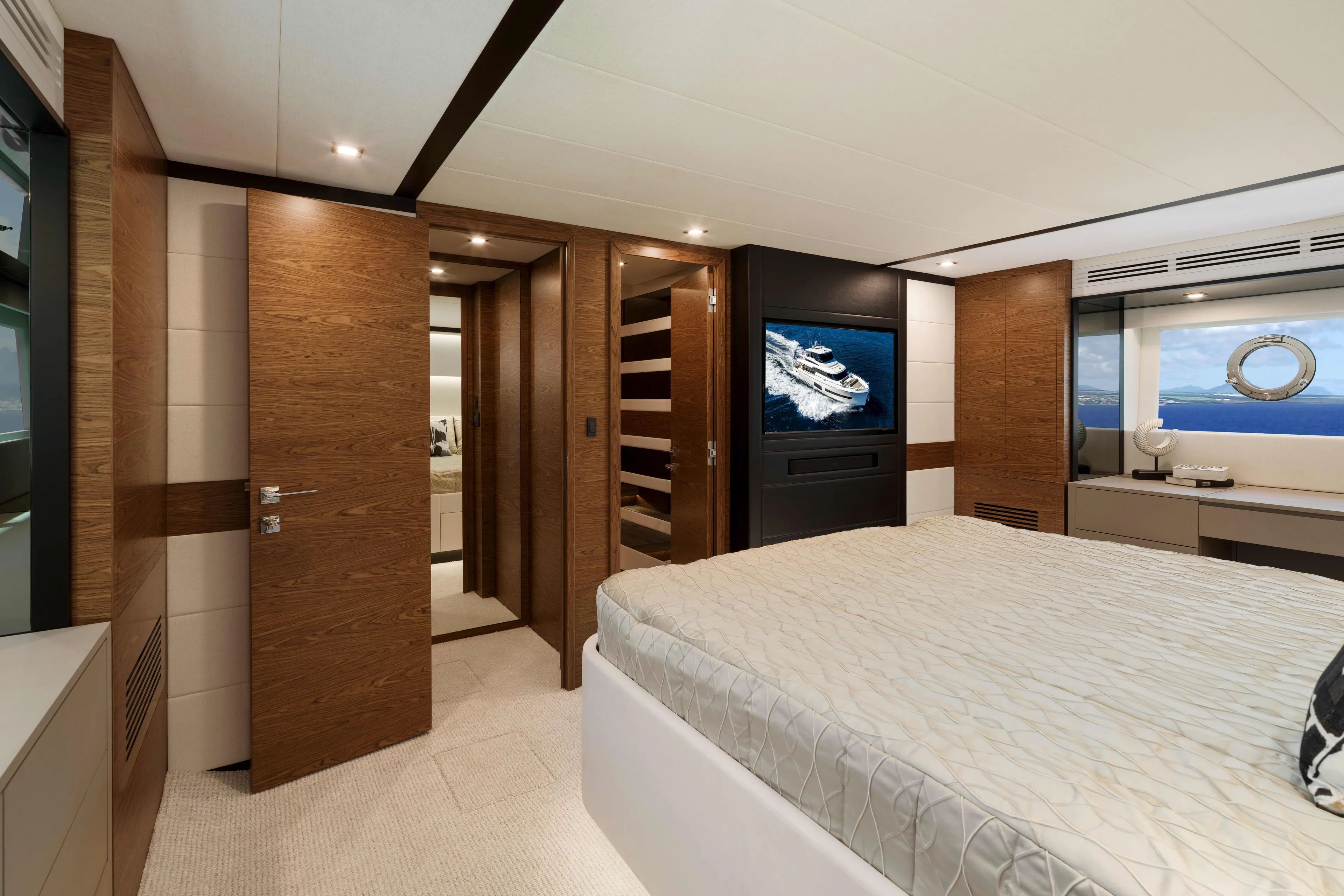 V77s-613 / Available Spring 2026 Yacht Photos Pics Luxurious Horizon V77S 2026 yacht bedroom with elegant wood accents and ocean view.