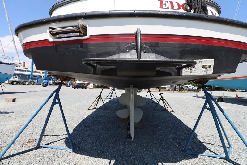Edgin Yacht Photos Pics 2007 Nordic Tug 32 boat on stands, showcasing hull and propeller.