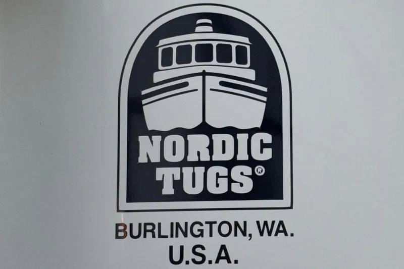 Edgin Yacht Photos Pics Nordic Tugs logo with Burlington, WA, USA text, 2007 Nordic Tug 32 model.
