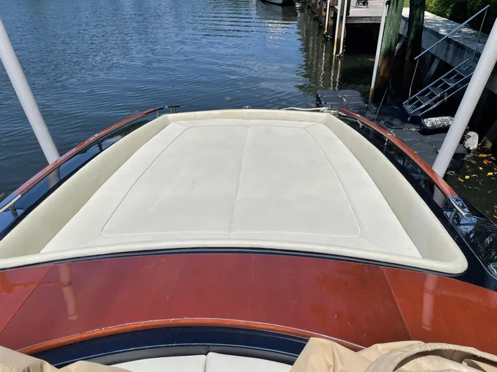 No Name Yacht Photos Pics 2016 Riva AQUAVIVA SUPER boat with sleek deck design docked by the water.