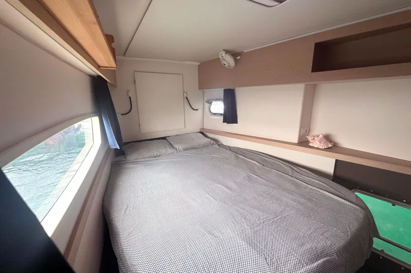 Katla Yacht Photos Pics Cozy bedroom in 2018 Fountaine Pajot Helia 44 Evolution catamaran with window view.