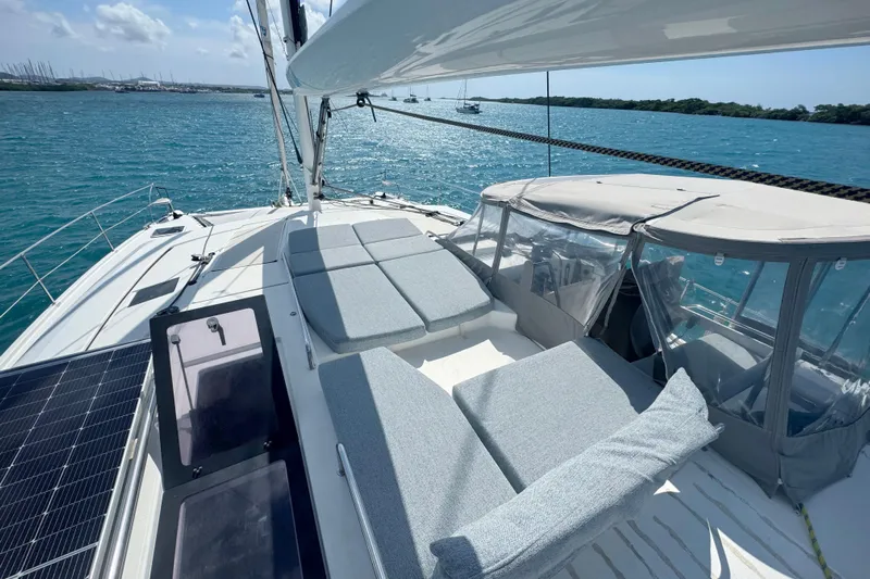 Katla Yacht Photos Pics 2018 Fountaine Pajot Helia 44 Evolution catamaran with sunbathing area on turquoise waters.
