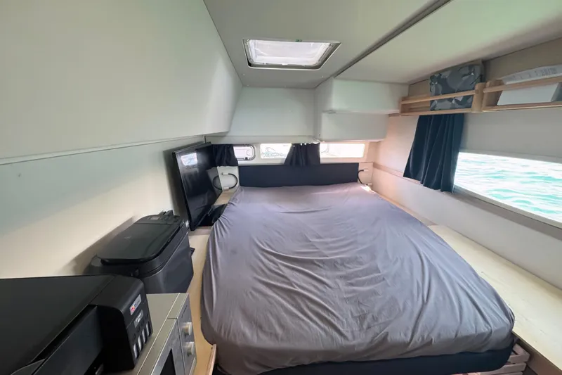 Katla Yacht Photos Pics Interior cabin of 2018 Fountaine Pajot Helia 44 Evolution catamaran, featuring a cozy bed.