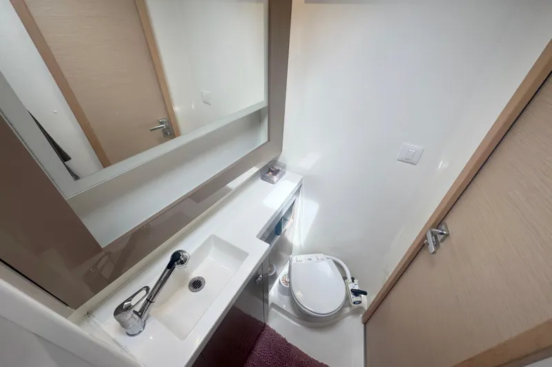 Katla Yacht Photos Pics Bathroom interior of 2018 Fountaine Pajot Helia 44 Evolution yacht, featuring modern fixtures.