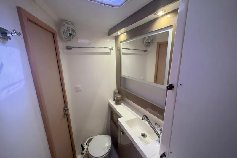 Katla Yacht Photos Pics Bathroom interior of 2018 Fountaine Pajot Helia 44 Evolution catamaran, featuring modern fixtures.