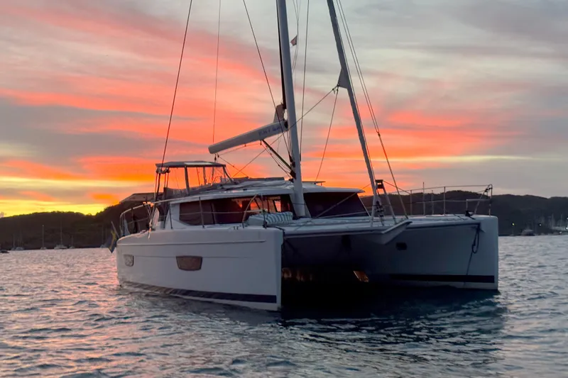 Katla Yacht Photos Pics 2018 Fountaine Pajot Helia 44 Evolution catamaran at sunset on calm waters.
