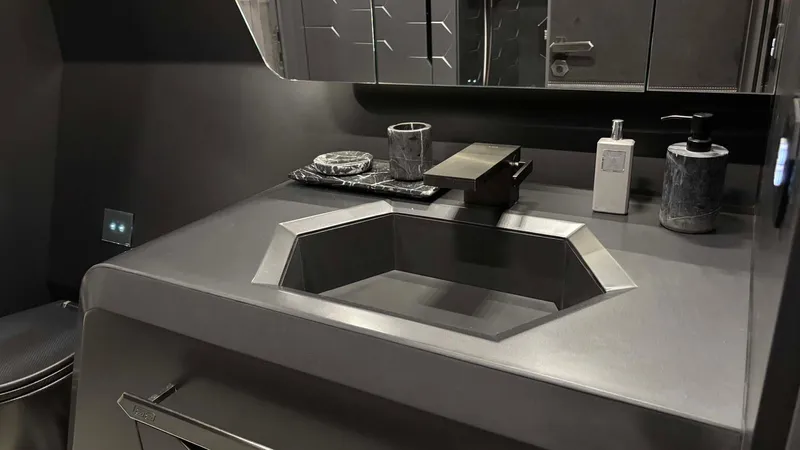  Yacht Photos Pics Luxurious bathroom interior of 2022 Tecnomar Lamborghini 63 yacht, featuring sleek modern design.