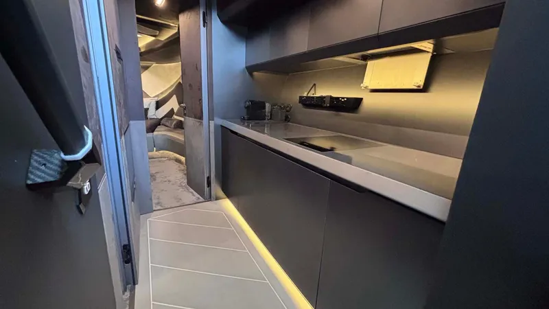  Yacht Photos Pics Luxurious interior of 2022 Tecnomar Lamborghini 63 yacht, featuring sleek modern kitchen design.