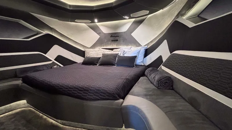  Yacht Photos Pics Luxurious interior of 2022 Tecnomar Lamborghini 63 yacht with modern bed and sleek design.