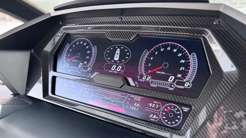  Yacht Photos Pics Dashboard of 2022 Tecnomar Lamborghini 63 yacht with carbon fiber finish and digital displays.