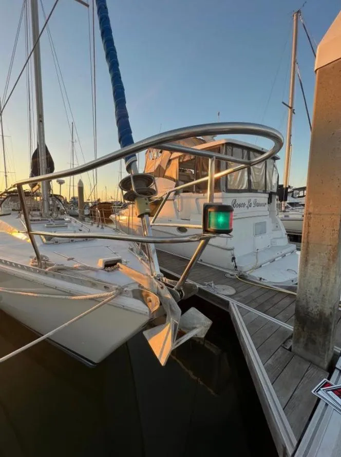 Gib'Sea 126 sailboat from 1985 docked at sunset, featuring a sleek bow design.
