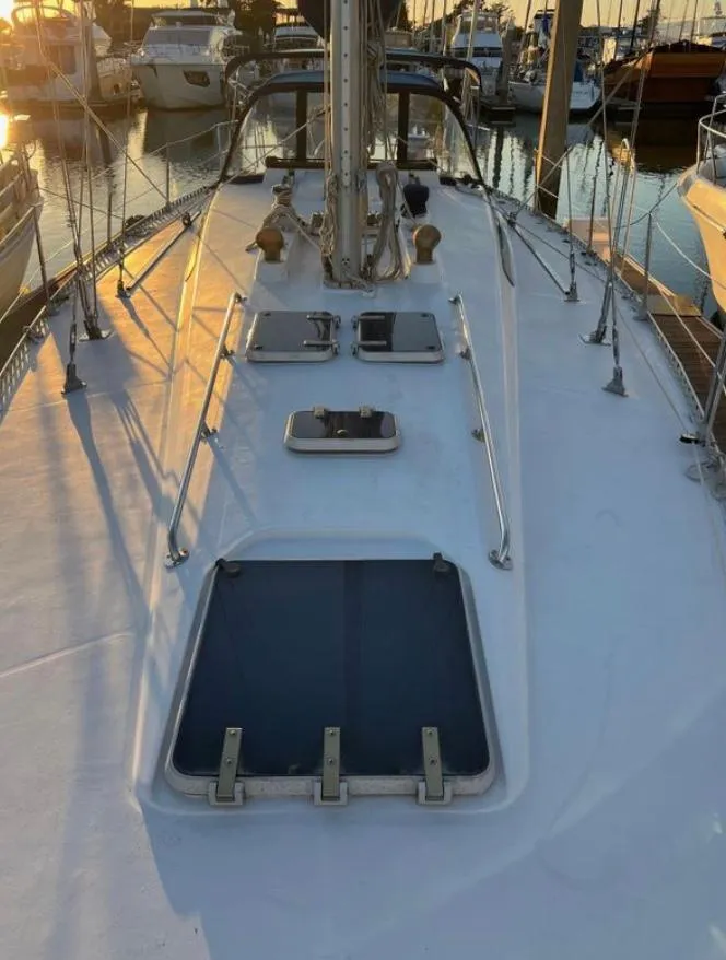 1985 Gib'Sea 126 sailboat deck at sunset in marina.