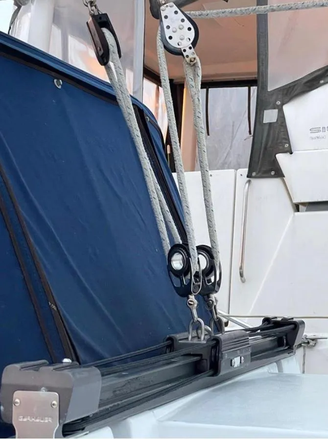 Sailing rigging on a 1985 Gib'Sea 126 yacht, featuring ropes and pulleys.