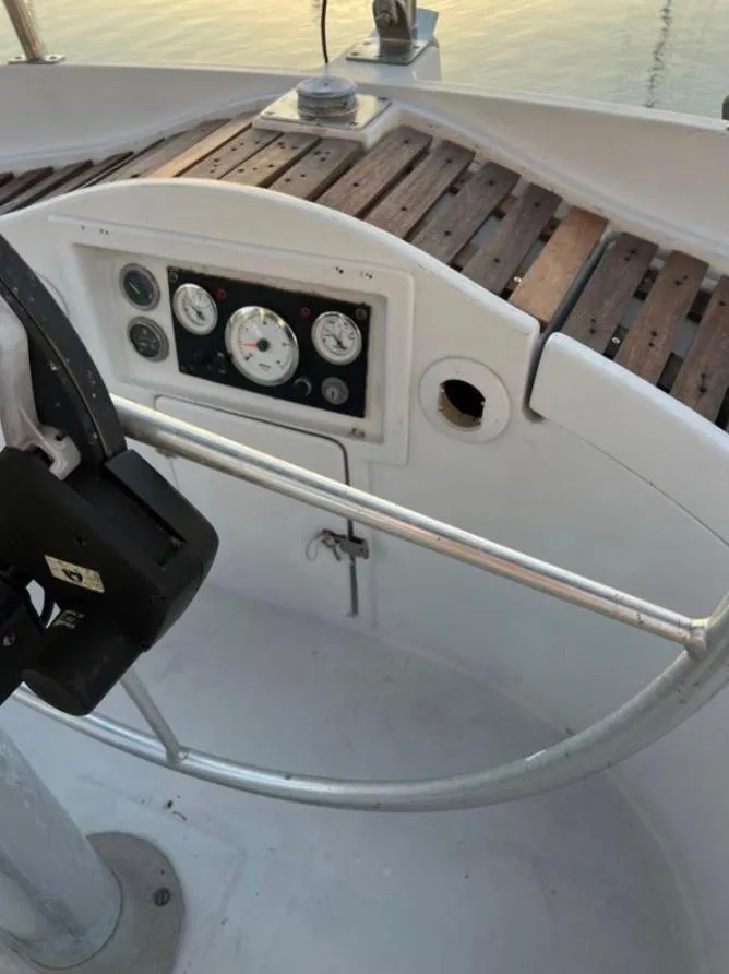 Cockpit of 1985 Gib'Sea 126 sailboat with steering wheel and instrument panel.