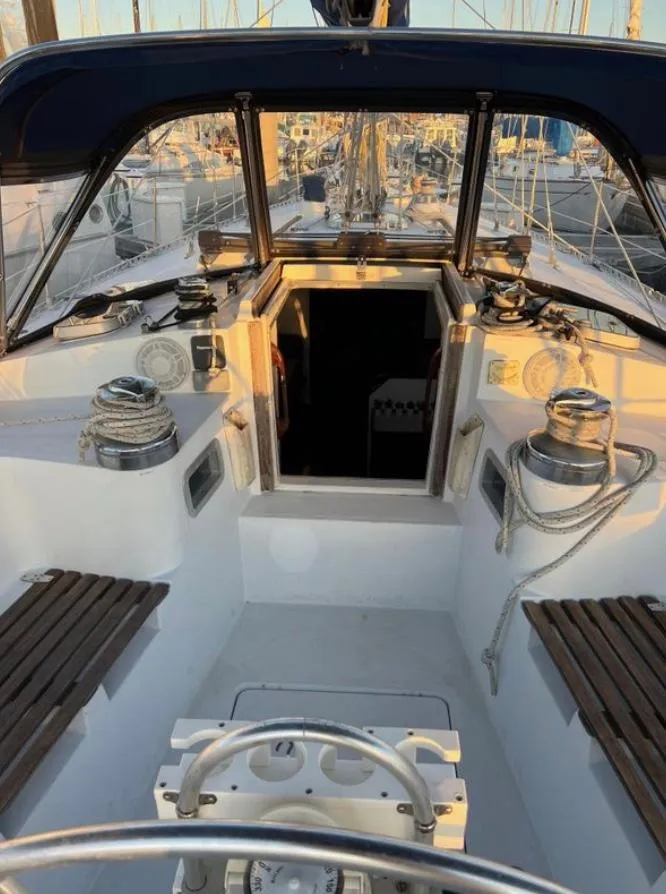 1985 Gib'Sea 126 sailboat cockpit with winches and seating, docked at marina.