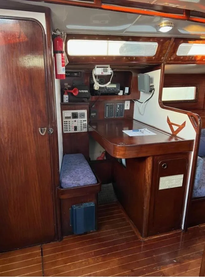 1985 Gib'Sea 126 yacht interior with navigation station and wooden finish.