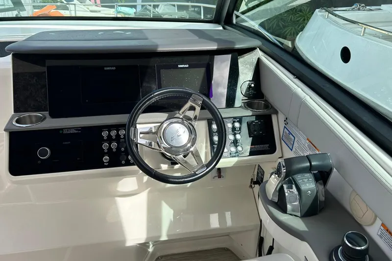  Yacht Photos Pics 2020 Sea Ray Sundancer 320 helm with modern controls and dual Simrad displays.