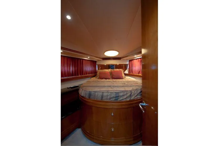 Size Matter's Yacht Photos Pics Luxurious bedroom in 2001 Carver 530 Voyager Pilothouse yacht with elegant wood finish.
