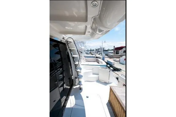 Size Matter's Yacht Photos Pics 2001 Carver 530 Voyager Pilothouse yacht deck with marina view.