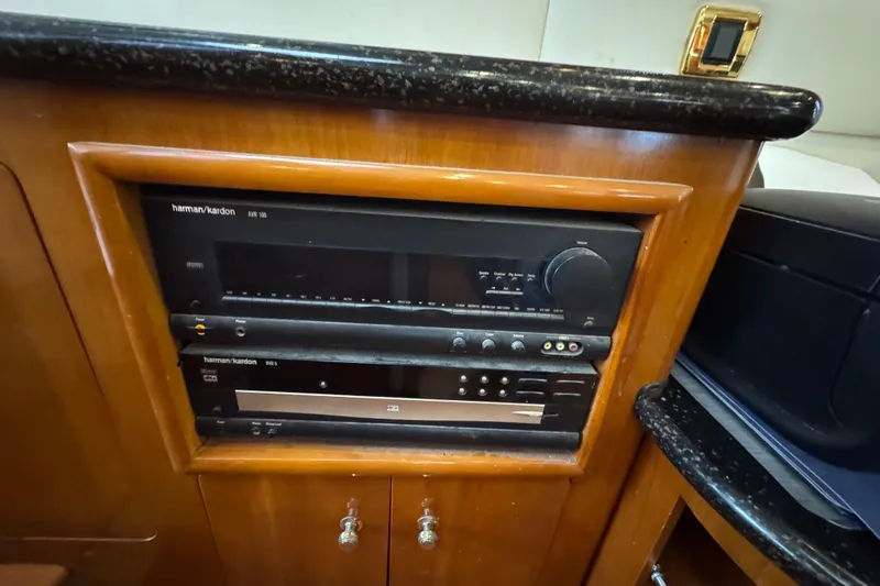 Size Matter's Yacht Photos Pics Harman Kardon audio system in 2001 Carver 530 Voyager Pilothouse yacht interior.