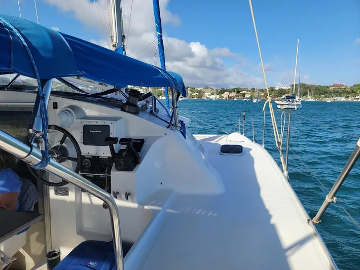 Cat Tales Yacht Photos Pics 1996 Fountaine Pajot Tobago 35 catamaran sailing on a sunny day with blue skies.