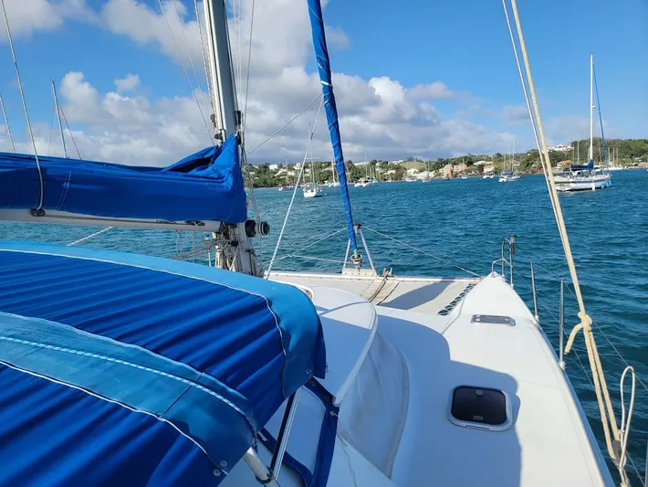 Cat Tales Yacht Photos Pics Sailing on a 1996 Fountaine Pajot Tobago 35 catamaran in a scenic bay.