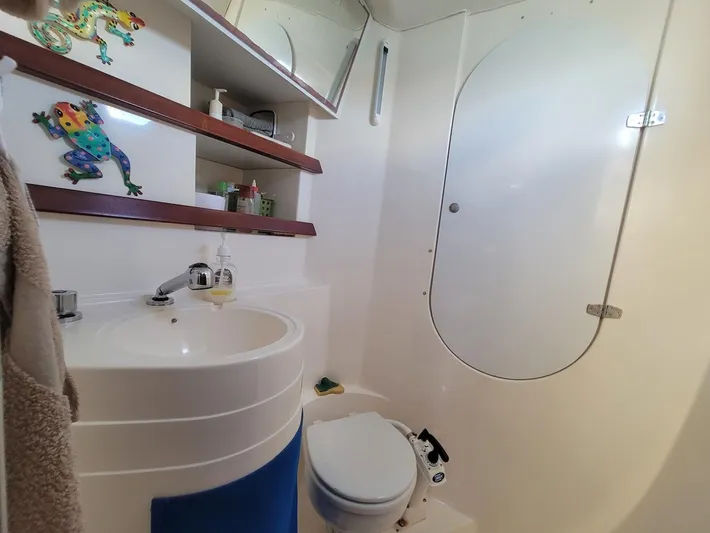 Cat Tales Yacht Photos Pics Bathroom interior of 1996 Fountaine Pajot Tobago 35 catamaran, featuring sink and toilet.